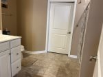 Master Bedroom Suite on Main Floor w a King Bed, a Full Master Bathroom and Huge Walk-In Closet